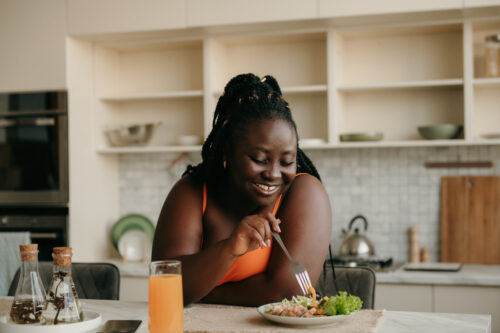 Woman enjoying a meal at home